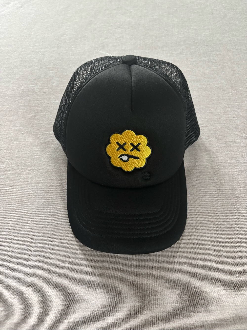 The Ghetto Flower NWOT black mesh trucker hat.